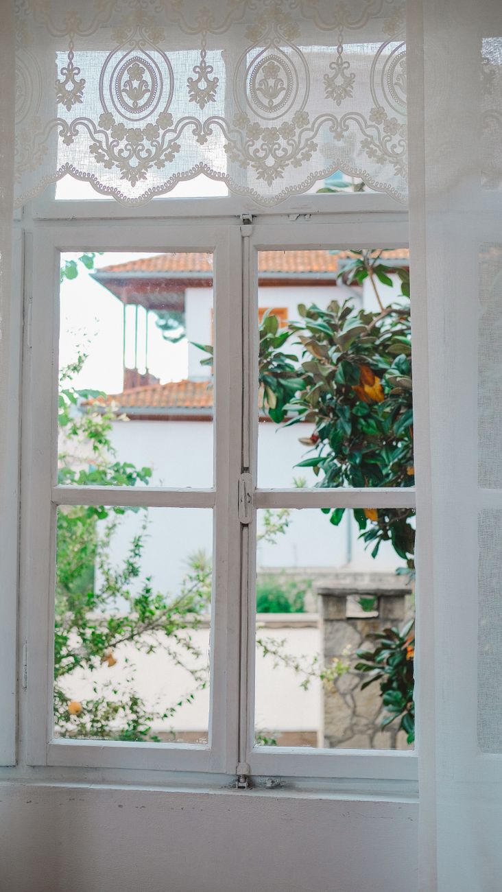 rustic house window with curtains